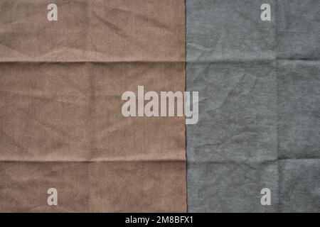 Folded brown and gray fabric texture background Stock Photo