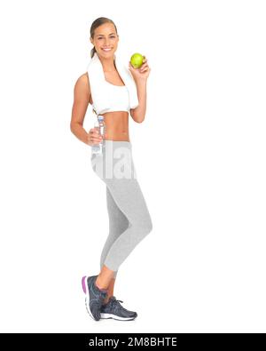 Woman, apple and bottle water in diet planning, healthy eating or weight loss against a white studio background. Portrait of isolated young female Stock Photo
