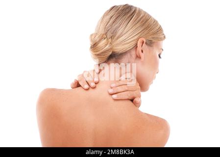 Blond woman, back and hands in skincare, beauty and touching neck against a white studio background. Isolated young female with blond hair relaxing in Stock Photo