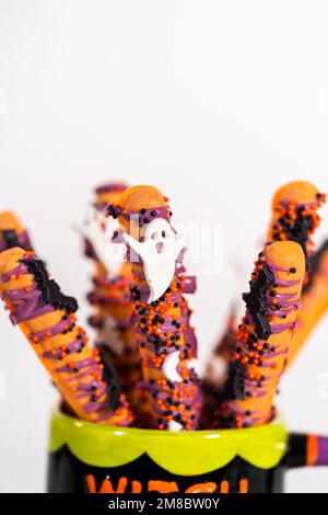 Halloween chocolate-covered pretzel rods Stock Photo - Alamy