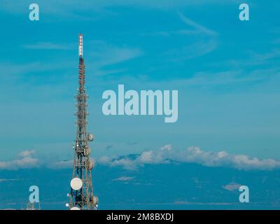 Antenna for telecommunications, radio and television transmitting apparatus, electrical and electronic apparatus. Vibo Valentia, Calabria. Italy Stock Photo