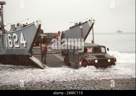 M998 high mobility, Multi-purpose wheeled vehicles are offloaded from the utility landing craft LCU 1624 during the joint Thai/US combined exercise THALAY THAI '89. Subject Operation/Series: THALAY THAI '89 Country: Thailand (THA) Stock Photo