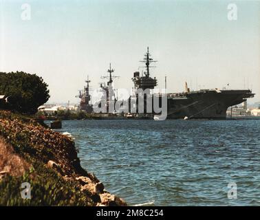 A copy image of three aircraft carriers: the US Navy (USN) Kitty Hawk Class USS CONSTELLATION (CV 64), USN Forrestal Class USS INDEPENDENCE (CV 62) and USS RANGER (CVA 61), docked at Naval Air Station North Island (NASNI), California. (Exact date shot unknown). Base: Naval Air Station, North Island State: California (CA) Country: United States Of America (USA) Stock Photo