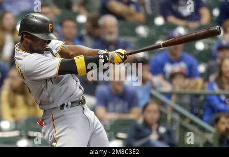 FILE - Pittsburgh Pirates' Andrew McCutchen holds the team's home run sword  as he celebrates in the dugout with teammates after hitting a solo home run  against the Seattle Mariners Friday, May