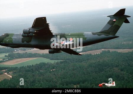 A Pilatus PC-9 aircraft, center foreground, and an Army T-28B Tojan ...