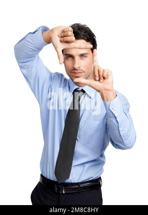 Portrait, businessman and finger frame on studio background for profile picture. Young worker, hand sign and framing face for corporate perspective Stock Photo