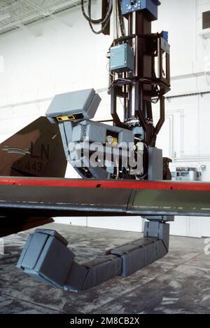 A maneuverable X-ray machine inspects the wing of an F-111 aircraft in the base's non-destructive inspection facility. The 110-ton robot is one of two newly developed devices used to detect aircraft structural flaws. Base: Mcclellan Air Force Base State: California (CA) Country: United States Of America (USA) Stock Photo