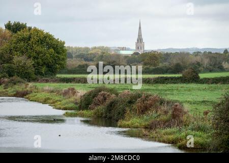 view of The Chichester Ship Canal with the Cathedral spire in the background West Sussex England Stock Photo