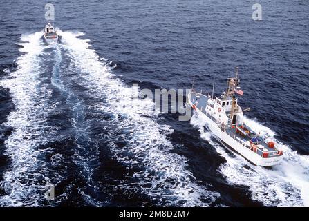 A 41-foot US Coast Guard patrol boat passes the patrol boat USCGC POINT ...