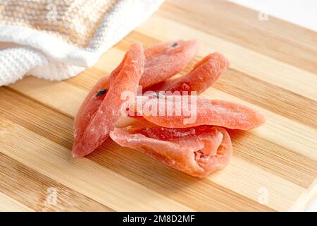 Dried tropical organic natural passion fruit with sugar on the wooden board background in the kitchen. Stock Photo