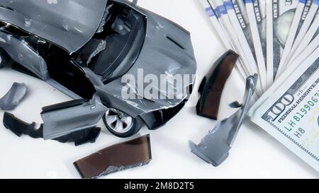 Conceptual car accident with money on white background from above Stock Photo