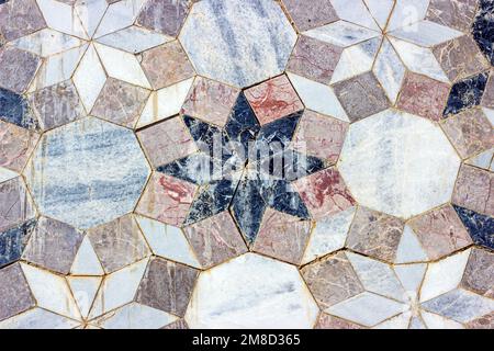 Gray vintage marble ceramic tile textured background on the old building stone brick wall close up. Stock Photo