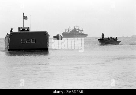 Two LCM-8 mechanized landing craft head for shore to pick up Marine Corps vehicles and equipment that will be loaded aboard amphibious ships and transported to South Korea for use in the combined South Korean/U.S. exercise Team Spirit '90. The amphibious cargo ship USS ST. LOUIS (LKA-116) is in the background. Subject Operation/Series: TEAM SPIRIT '90 State: Okinawa Country: Japan (JPN) Stock Photo