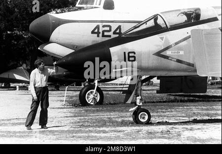 A visitor to the U.S. Naval Aviation Museum peers inside an Apollo ...