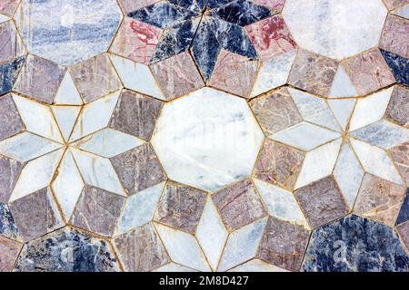Gray vintage marble ceramic tile textured background on the old building stone brick wall close up. Stock Photo