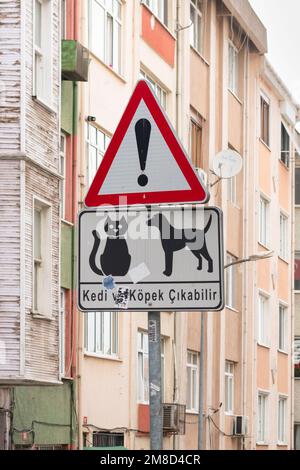 Traffic warning sign of cats and dogs wandering in the street - Istanbul, Turkey Stock Photo