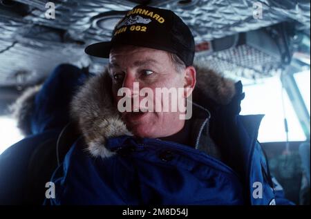 Aboard the nuclear-powered submarines USS GURNARD (SSN 662), Secretary of the Navy H. Lawrence Garrett III participates in a deployment beneath the Arctic ice off of Alaska. Country: Arctic Ocean Stock Photo