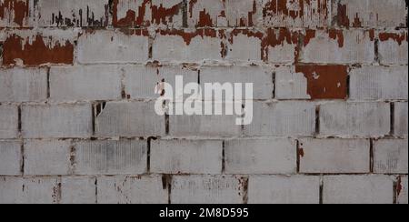 Brick Wall Texture with Cracks. Peeling brick Wall. Background Stock Photo