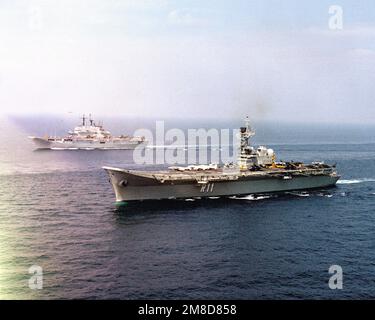 A port view of the Spanish aircraft carrier SPS PRINCIPE DE ASTURIAS (R-11), foreground, and Italian light aircraft carrier ITS GIUSEPPE GARIBALDI (C-551), underway during the NATO Southern Region exercise DRAGON HAMMER '90. Subject Operation/Series: DRAGON HAMMER '90 Country: Mediterranean Sea (MED) Stock Photo