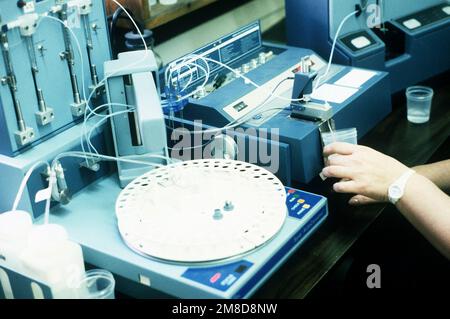 A technician performs a urinanalysis. Base: Seneca Army Depot, Romulus State: New York (NY) Country: United States Of America (USA) Stock Photo