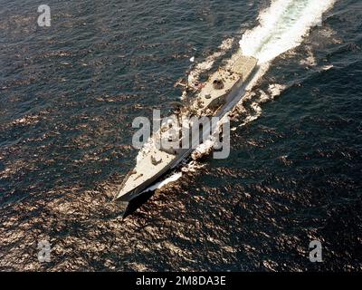 A aerial port bow view of the guided missile frigate USS RENTZ (FFG 46) underway. Country: Unknown Stock Photo