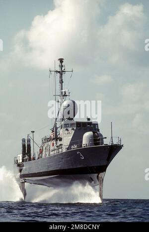 A starboard bow view of the hydrofoil patrol combatant missile ship USS TAURUS (PHM-3), foil-borne. Navy hydrofoils are regularly used on Joint Task Force 4 drug interdiction missions. Country: Unknown Stock Photo