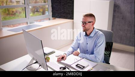 Financial Tax Advisor In Video Conference Meeting Call Stock Photo