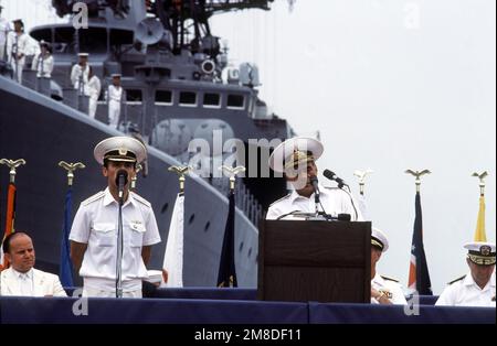 With an interpreter standing nearby, Admiral (ADM) Gennadiy Khvatov, Commander, Soviet Pacific Fleet, speaks during a media conference held at the beginning of a five-day goodwill visit by three Soviet ships. Vice Admiral John H. Fetterman Jr., Commander, Naval Air Force, United States Pacific Fleet, is seated at right. The Soviet guided missile destroyer ADMIRAL VINOGRADOV is in the background. Base: Naval Air Station, San Diego State: California (CA) Country: United States Of America (USA) Stock Photo