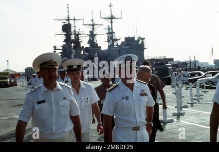 A Soviet vice admiral, left, is accompanied by Vice Admiral John H. Fetterman Jr., Commander, Naval Air Force, United States Pacific Fleet, right, during a tour of the base. Three ships of the Soviet Pacific Fleet are in San Diego for a five-day goodwill visit. Base: Naval Air Station, San Diego State: California (CA) Country: United States Of America (USA) Stock Photo