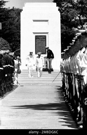 ADM Charles R. Larson, left, commander in chief, U.S. Pacific Fleet, and ADM Gennadiy Khvatov, commander, Soviet Pacific Fleet, walk down the stairs at the foot of a memorial during a wreath-laying ceremony at Fort Rosecrans National Cemetery. The ceremony is being held to honor those members of the U.S. Merchant Marine who died while delivering supplies to the Soviet Union during World War II. Three ships of the Soviet Pacific Fleet are in San Diego for a five-day goodwill visit. Base: San Diego State: California (CA) Country: United States Of America (USA) Stock Photo