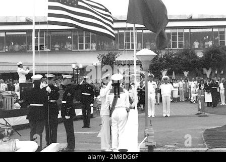 ADM Charles R. Larson, left, commander in chief, U.S. Pacific Fleet, and ADM Gennadiy Khvatov, commander, Soviet Pacific Fleet, salute as U.S. Marines and Soviet sailors lower their respective nations' flags during an evening colors ceremony outside the Admiral Kidd Club. Three ships of the Soviet Pacific Fleet that have come to San Diego for a five-day goodwill visit. Base: Naval Air Station, San Diego State: California (CA) Country: United States Of America (USA) Stock Photo