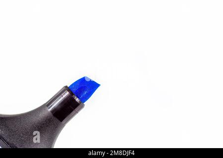 Black marker pen with bright blue tip on light background close up with copy space. Stock Photo