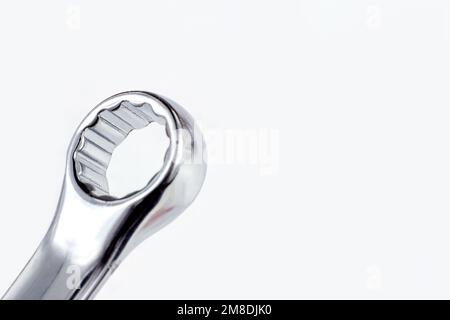Silver metal ring spanner for maintenance close up on white background with copy space. Stock Photo