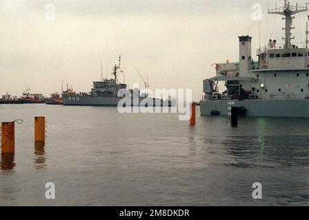 Tug boats move the ocean minesweeper USS LEADER (MSO-490) clear of the ...