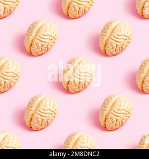 Pink human brain repeat seamless pattern on pastel background. Creativite wrapping paper design concept. Stock Photo