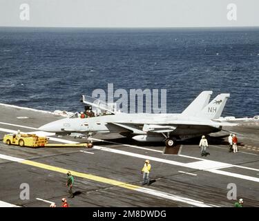 An MD-3A tow tractor is used to tow an Attack Squadron 72 (VA-72) A-7E ...