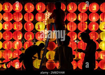 Jenjarom, Selangor, Malaysia. 13th Jan, 2023. Workers are silhouetted as they install lanterns ahead of Chinese Lunar New Year at Fo Guang Shan Dong Zen Buddhist Temple Jenjarom. (Credit Image: © Mohd Daud/ZUMA Press Wire) EDITORIAL USAGE ONLY! Not for Commercial USAGE! Stock Photo