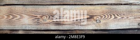 Natural texture from burnt pine boards as a background with copy space. Stock Photo