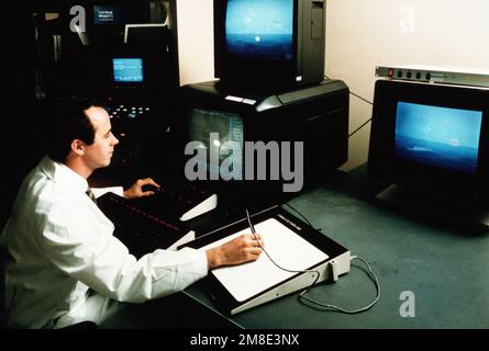 A software technician works on a simulation of an anti-ship missile engagement for use in electronic warfare effectiveness tests that are conducted in the Central Target Simulator facility at the Naval Research Laboratory (NRL). Base: Washington State: District Of Columbia (DC) Country: United States Of America (USA) Stock Photo