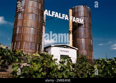 Twin silos with a sign reading Alfalfa Farms hanging between them at the Alfalfa Farms winery. Topsfield, Massachusetts. The image was captured on ana Stock Photo