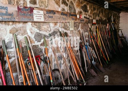 Various size shovels and garden tools stacked in a row at the Codman Community Farms.  Lincoln, Massachusetts. The image was captured on analog film. Stock Photo