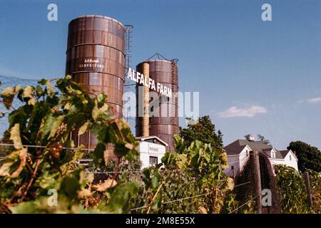 Twin silos with a sign reading Alfalfa Farms hanging between them at the Alfalfa Farms winery. Topsfield, Massachusetts. The image was captured on ana Stock Photo