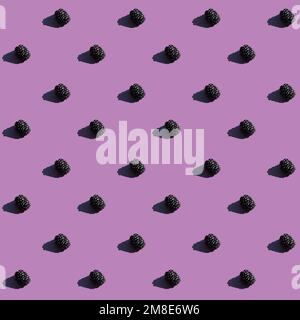 seamless pattern of blackberries on purple background  Stock Photo