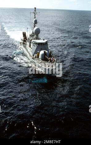 A starboard bow view of the patrol combatant missile hydrofoil USS HERCULES (PHM-2) underway on its hull with its foils extended beneath the surface. Country: Gulf Of Mexico Stock Photo