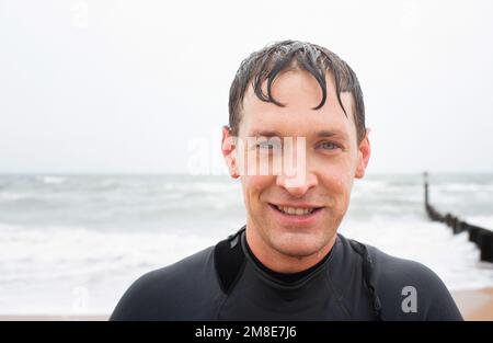 Portrait of a man after cold water swimming in the sea Stock Photo