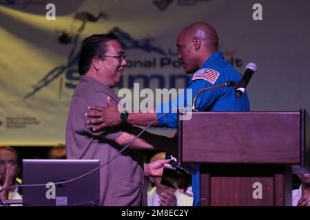 US Navy Captain and NASA astronaut Victor Glover (right) shakes hands with Brian Yokoyama during the opening session of the UCS Spirit National Pole V Stock Photo