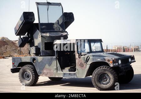 A view of an Avenger air defense system deployed with Btry. A, 2nd Bn., 6th Air Defense Artillery Bde., during Operation Desert Shield. The Avenger consists of a four-tube Stinger anti-aircraft missile launcher mounted on each side of an operator's station on a pedestal carried by an M-998 High-Mobility Multipurpose Wheeled Vehicle (HMMWV). A .50-caliber machine gun can be mounted beneath the right side Stinger launcher. Subject Operation/Series: DESERT SHIELD Country: Saudi Arabia (SAU) Stock Photo