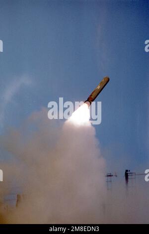 A BGM-109 Tomahawk Land-Attack Missile (TLAM) gains altitude after being fired at an Iraqi shore target by the battleship USS WISCONSIN (BB-64) during Operation Desert Storm. Country: Unknown Stock Photo