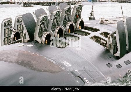 The hatches of the 12 vertical-launch Tomahawk missile tubes stand open on the bow of the nuclear-powered attack submarine USS OKLAHOMA CITY (SSN-723). Base: Naval Station, Norfolk State: Virginia (VA) Country: United States Of America (USA) Stock Photo