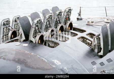 The hatches of the 12 vertical-launch Tomahawk missile tubes stand open on the bow of the nuclear-powered attack submarine USS OKLAHOMA CITY (SSN-723). Base: Naval Station, Norfolk State: Virginia (VA) Country: United States Of America (USA) Stock Photo
